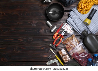 Earthquake Supply Kit On Wooden Table, Flat Lay. Space For Text