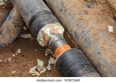 Earthworks. Repair of heating in autumn and winter. Break of piping hot water. Welding. - Shutterstock ID 747871849