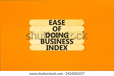 Ease of doing business index symbol. Concept words Ease of doing business index on wooden stick. Beautiful orange table orange background. Business, ease of doing business index concept. Copy space.