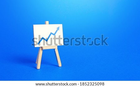 Easel and up arrow chart. Concept of success, growth and performance improvement. Statistics and business analytics. Income revenue statement analysis. High efficiency, productivity. Economic progress
