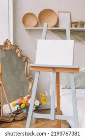 Easel With Blank Canvas In Aesthetic Home Interior. Mockup, Template. Art, Hobby Concept.