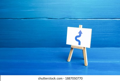An easel with a curved arrow avoiding an obstacle. Deviation from route, side mission. Maneuvering, taking right action. Purposefulness and perseverance, confident movement towards the assigned goal.
