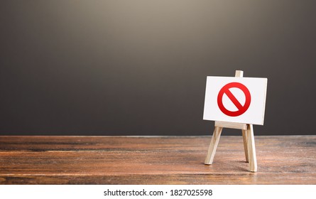 Easel with the prohibition sign NO. Restricted area. Restrictions and sanctions. Inaccessibility. Blocking. Out of stock. Ban and Embargo. Failed strategy. Denying entry, stopping action processes. - Shutterstock ID 1827025598