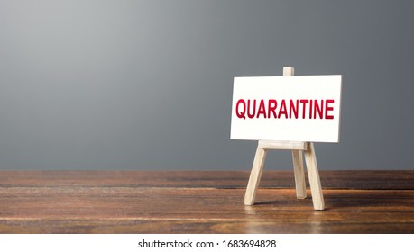 Easel With A Word Quarantine. Tough Measures To Stop New Infections Of Coronavirus COVID-19 Exponential Growth. Self-isolation During Pandemic. Administrative Restrictions At Contagion Epicenters