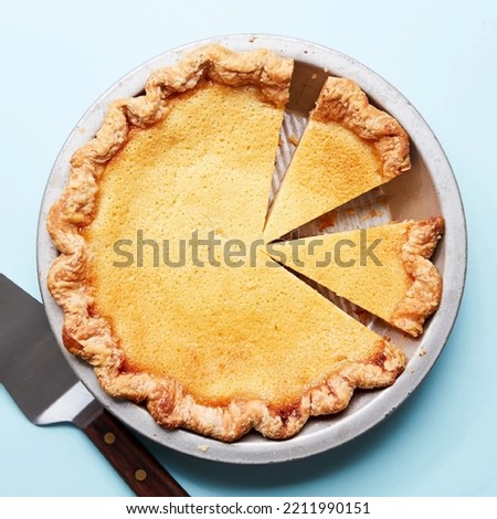 The Easiest Buttermilk Pie with light blue background
