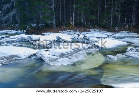 East Branch of the Sacandaga River during ice out in early spring in the Adirondack Mountains Of New York State