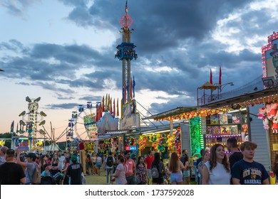 East Brunswick, New Jersey - August 10, 2019:  Groups Of People Gather And Stand In Different Lines At The Local County Fair To Experience The Games And Rides Offered.