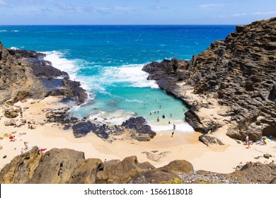 East Coast, Hawaii / USA - August 25 2019: Halona Beach Cove Is A Small Sandy Beach Surrounded By Rocky Cove At Oahu Southeast, It Attracts People For Swimming And Suntanning While Calm Tides.