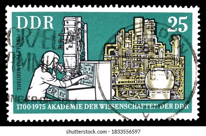 East Germany - Circa 1975 : Cancelled Postage Stamp Printed By East Germany, That Shows Electron Microscope And Chemical Plant, Circa 1975.