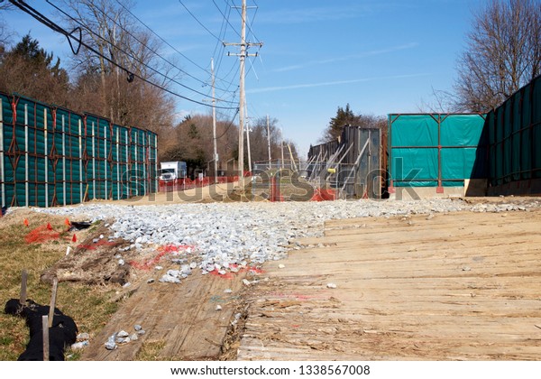 East Goshen\
Township, PA / USA - March 13, 2019: Erected barriers divide a\
residential area and the Mariner East II pipeline construction site\
in Chester County,\
Pennsylvania.