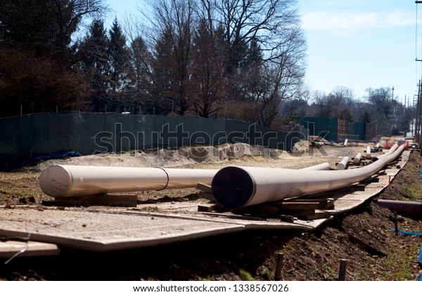 East Goshen\
Township, PA / USA - March 13, 2019: Erected barriers divide a\
residential area and the Mariner East II pipeline construction site\
in Chester County,\
Pennsylvania.