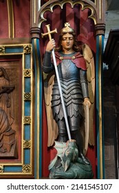 EAST GRINSTEAD, WEST SUSSEX, UK - MARCH 28: Wooden Statue Of George Slaying The Dragon In St Swithuns Church , East Grinstead, West Sussex On March 28, 2022