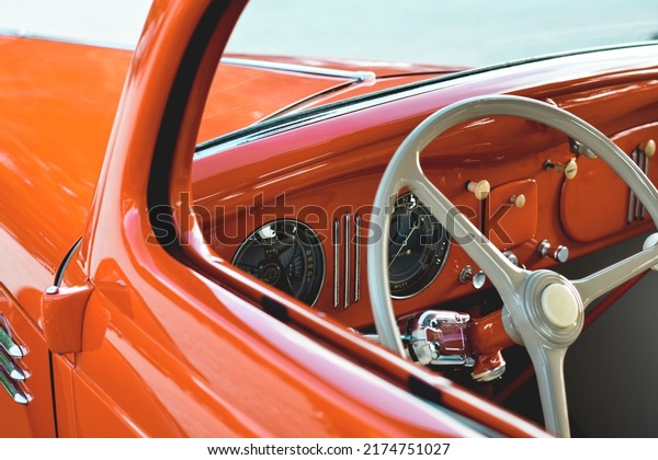 East\
Gwillimbury, Ontario, Canada - May 28, 2022: Closeup inside view of\
the old vintage retro orange Plymouth\
car