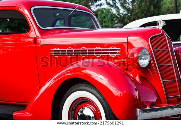 East Gwillimbury, Ontario,\
Canada - May 28, 2022: Closeup view of old vintage retro red\
Plymouth car