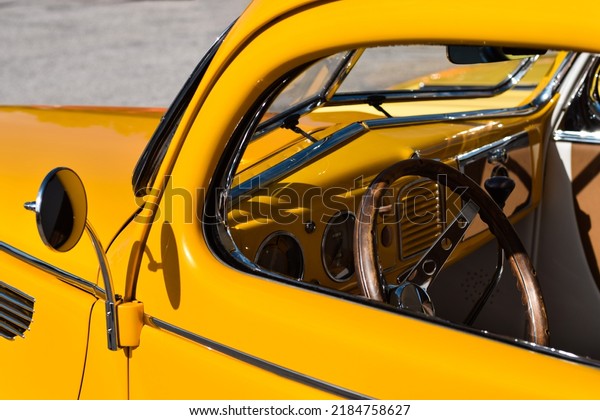 East Gwillimbury, Ontario,\
Canada - May 28, 2022: Interior of yellow vintage retro Ford V8\
car