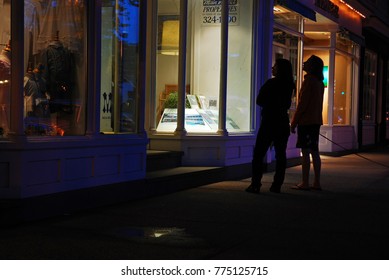 East Hampton, NY, USA, June 21, Two Adult Women Window Shop Along East Hampton, New York's Main Street At Night