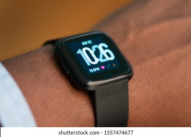 East Hartford, Connecticut, USA – November 3, 2019: close up of African American man wearing a Fitbit versa, Fitbit was recently acquired by Google’s parent company Alphabet