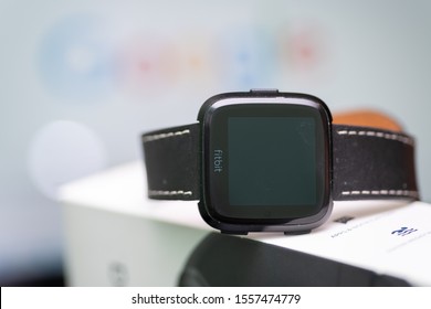 East Hartford, Connecticut, USA – November 3, 2019: close up of Fitbit versa with the original box, Fitbit was recently acquired by googles parent company alphabet