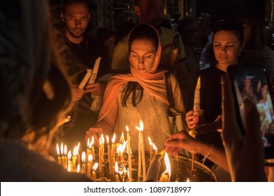 East Jerusalem, Jerusalem, Palestinian Territories. 5/11/18. The Church Of The Holy Sepulchre. Pilgrims Praying And Lighting Candles In A Land Of Conflict At A Time Of Heightened Tension 