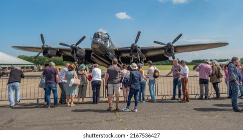 East Kirkby, Lincolnshire, UK – June 02 2022. A crowd of aviation enthusiasts admiring the Avro Lancaster Bomber NX611