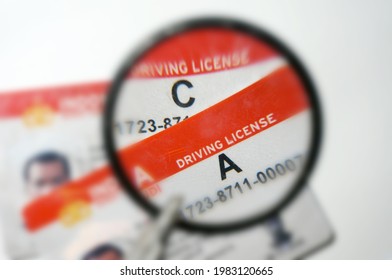 East Kutai, East Kalimantan, Indonesia - 01 June 2020: (SIM A and C) indonesia Driving License under magnifying glass with selective focus