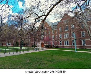 East Lansing, MI, USA - April, 17, 2021: Empty Michigan State University Campus On An Early Spring Day. Imposing Building Of The Giltner Hall, Bike Ramp With Lonely Bike, Fresh Grass. No People.