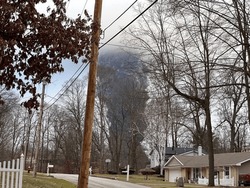 EAST PALESTINE, OH - Circa Feb 2023: The Rising Smoke Cloud After Authorities Released Chemicals From A Train Derailment As Seen From The Ground In A Nearby Neighborhood. Photo Credit: RJ Bobin.