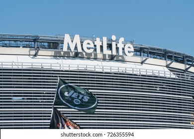 East Rutherford, New Jersey - Circa 2017: New York Jets Football Team Flag Waves In Wind During Parking Lot Tailgate Outside Metlife Stadium Before Season Game