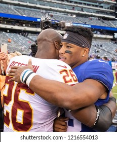 EAST RUTHERFORD, NEW JERSEY - OCTOBER 28, 2018: Adrian Peterson Talks To Saquon Barkley After NY Giants And WAS Redskins Game At MetLife Stadium In Rutherford, New Jersey On October 28, 2018.