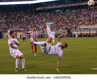 EAST RUTHERFORD, NJ - JULY 26, 2019: Captain and center back Sergio Ramos of Real Madrid #4 performing a bicycle kick during the 2019 International Champions Cup match against Atletico de Madrid 
