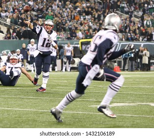 EAST RUTHERFORD, NJ - NOV 22: New England Patriots quarterback Tom Brady (12) throws a pass to wide receiver Brandon Lloyd (85)against the New York Jets at MetLife Stadium on November 22, 2012.