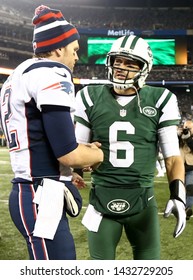 EAST RUTHERFORD, NJ - NOV 22:New England Patriots quarterback Tom Brady (12) and New York Jets quarterback Mark Sanchez (6) shake hands after the game at MetLife Stadium. on November 22, 2012.
