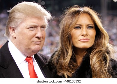 EAST RUTHERFORD, NJ-NOV 13: Donald Trump and wife Melania Trump before a football game at MetLife Stadium on November 13, 2011 in East Rutherford, New Jersey. 