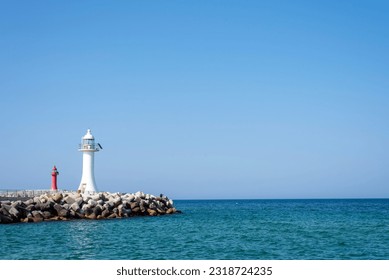 East sea breakwater landscape, with blue sky. - Powered by Shutterstock