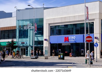 Eastbourne, East Sussex, United Kingdom- July 23 2022: Metro Bank On The High Street In Sunhine. Incidental People.