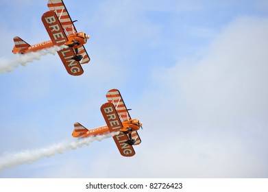 EASTBOURNE, ENGLAND - AUGUST 12 - Breitling Wingwalkers Female Daredevil Display Team Perform At Annual International Airshow On 12th August 2011 At Eastbourne In England