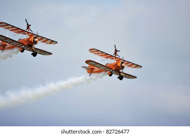 EASTBOURNE, ENGLAND - AUGUST 12 - Breitling Wingwalkers Female Daredevil Display Team Performs Amazing Stunts At Annual International Airshow On 12th August 2011 At Eastbourne In England