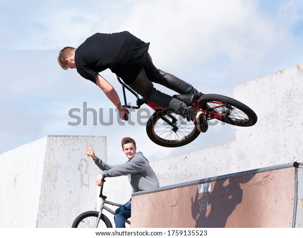 Eastbourne / UK - April 25, 2015: A\
young man performing tricks on a BMX bike at Sovereign\
Centre