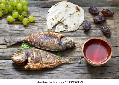 Easter Ancient Food With Fish Passover Bread And Goblet Of Wine Last Supper Concept
