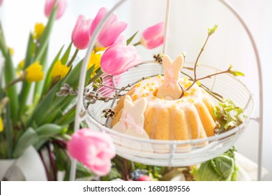 Easter Babka Cake And Bunny-shaped Cookies In A Basket On A Traditional Polish Table. Easter Family Breakfast.