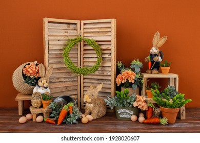 Easter backdrop or background for photo mini session in brown color. Contains straw rabbits. - Shutterstock ID 1928020607
