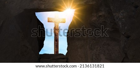 Easter background banner panorama, religious landscape -Crucifixion of Jesus Christ in Golgota Golgotha jerusalem israel, empty tomb with a view of crucified jesus on the cross, illuminated by the sun