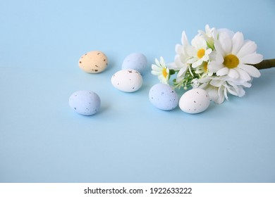 Easter background with bouquet white flwoer and easter eggs in soft color on blue sky background decorate and text copy space, happy and funny season in april