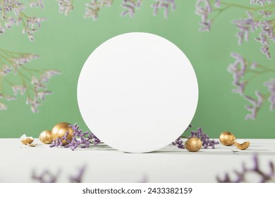 Easter background concept. Empty round podium, easter gold eggs with spring flowers on a green background