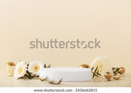 Easter background concept. Empty round podium, easter gold eggs with spring flowers on a yellow background