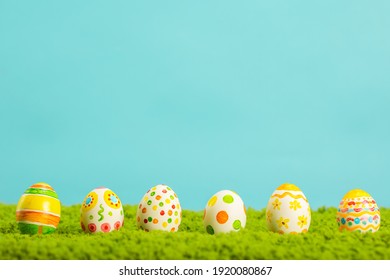 Easter background with cracked eggs green grass blue sky - Powered by Shutterstock