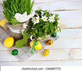 Easter background with Easter eggs and spring flowers.