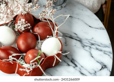 Easter background with Easter eggs and spring flowers.  Top view with copy space.