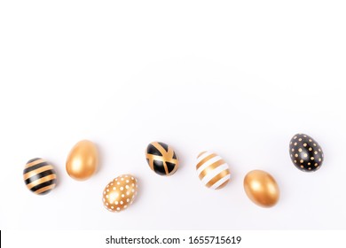 Easter background. Easter golden decorated eggs isolated on white background. Minimal easter concept. Flat Lay of Golden Easter Eggs. - Powered by Shutterstock