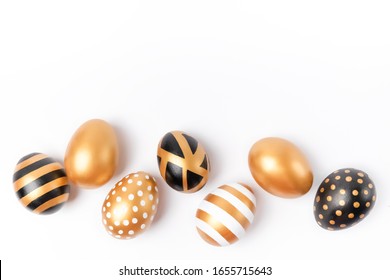 Easter background. Easter golden decorated eggs isolated on white background. Minimal easter concept. Flat Lay of Golden Easter Eggs. - Powered by Shutterstock